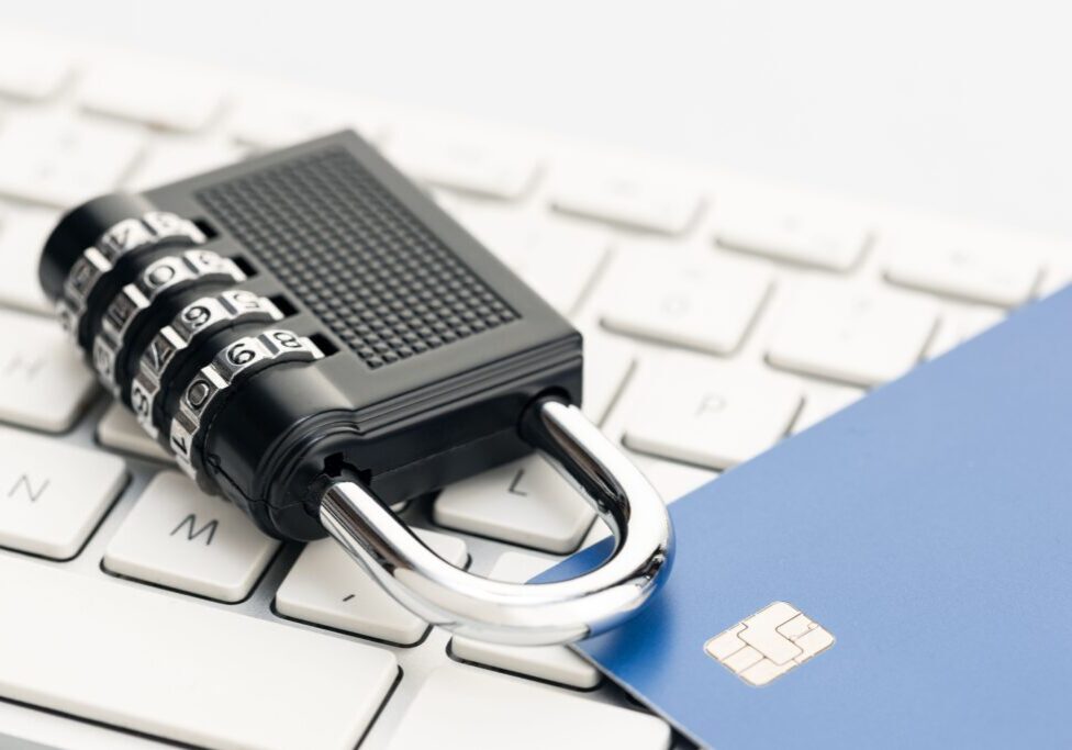 A Padlock and credit card on computer keyboard. E-commerce internet and finance security concept